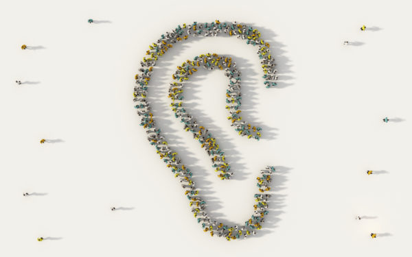 An ear shape formed by a large group of people