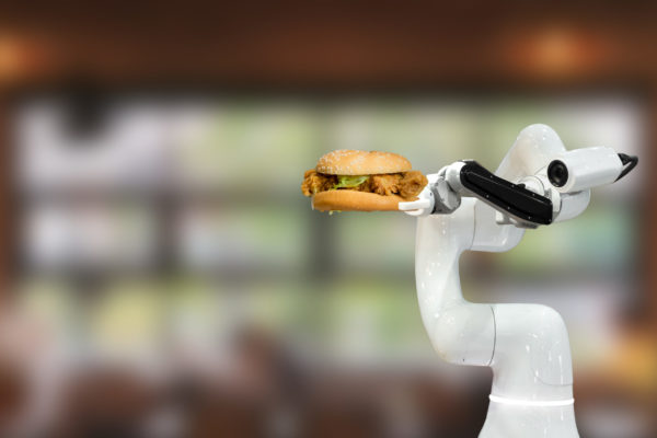 A robot delivers a fried chicken sandwich