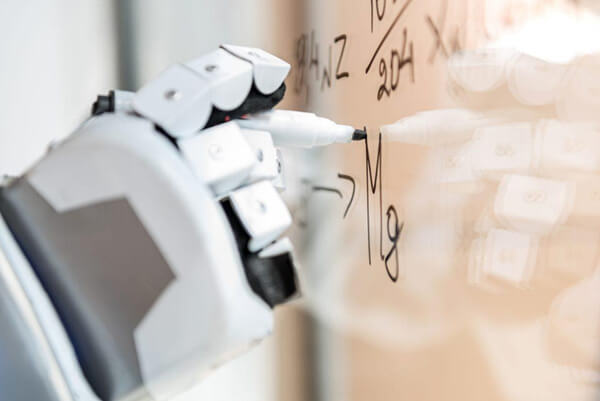 the hand of the Hemingway robot writing equations