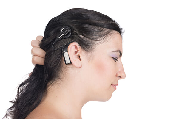 A young woman with a cochlear implant